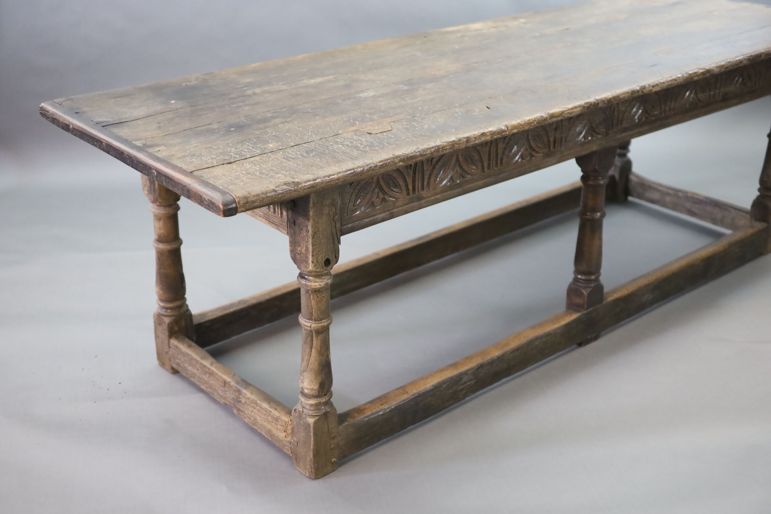 A 17th century oak and elm refectory table, L.255cm W.82cm H.78cm